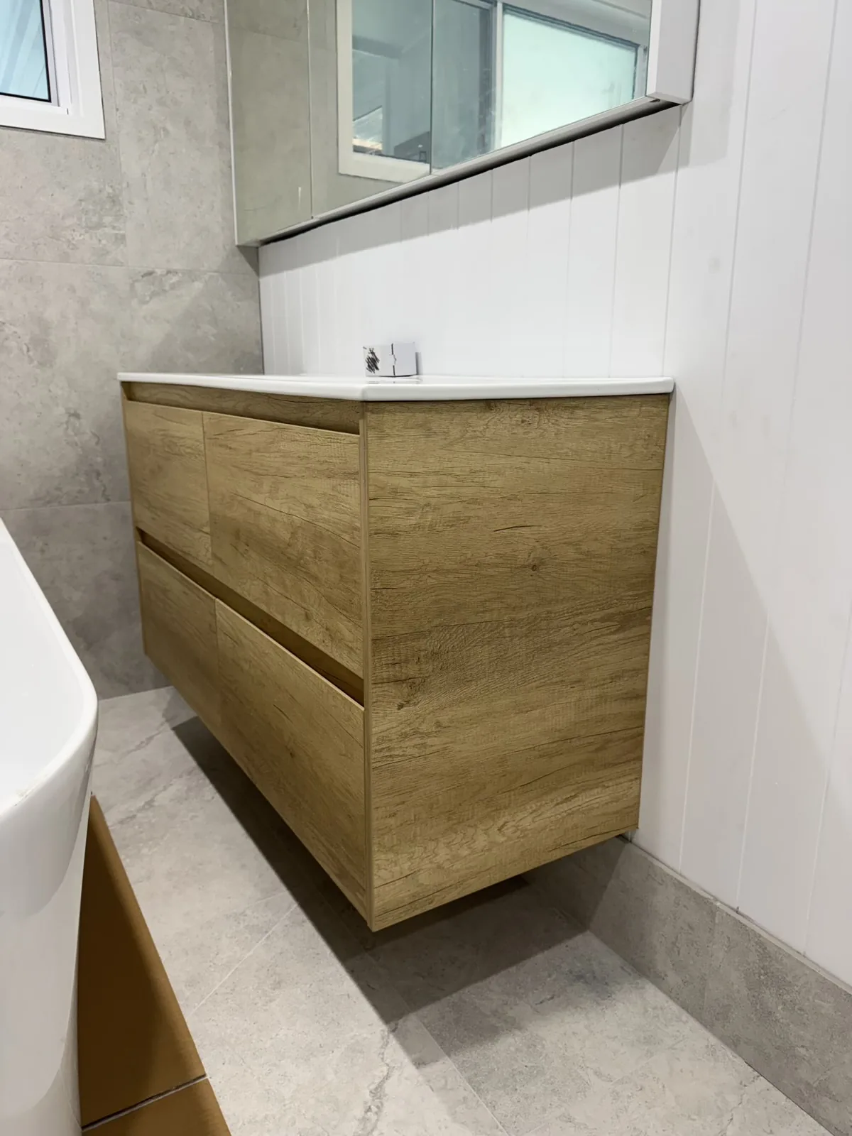 Timber-look bathroom vanity in finished bathroom