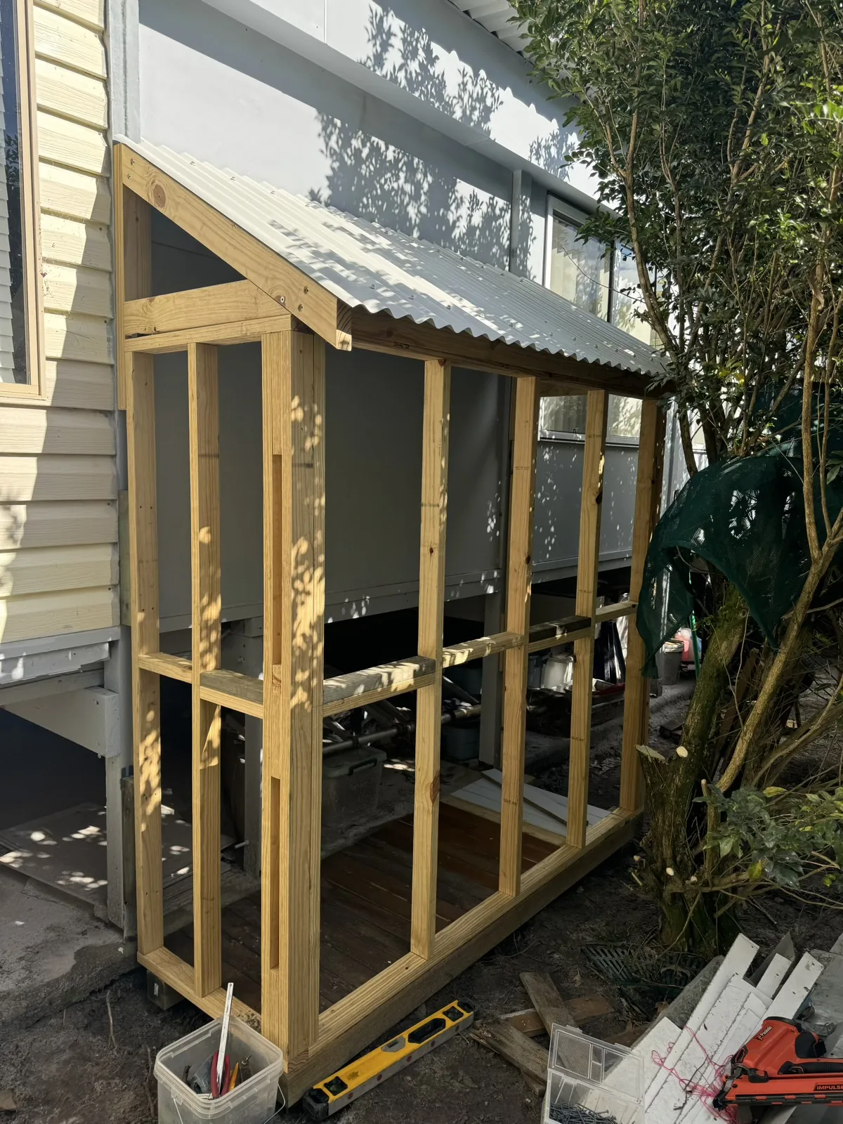 Timber framing and roof during screened enclosure construction